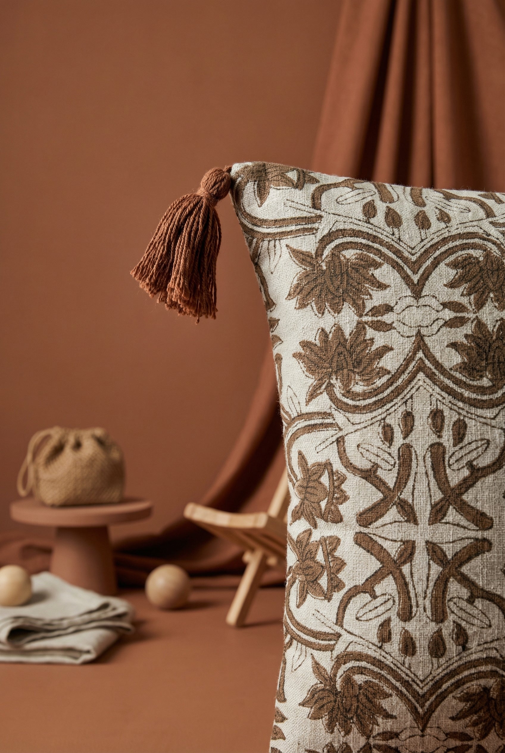 Brown & White Ethnic Motifs Printed Cotton Cushion Cover With Tassel Accents