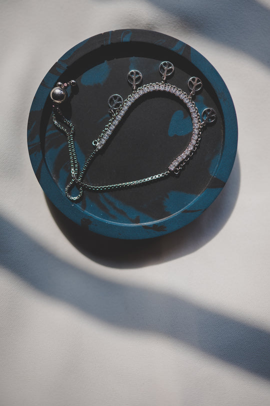 Tennis Bracelet Attached with Peace Charms