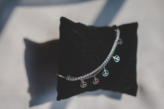 Tennis Bracelet Attached with Peace Charms